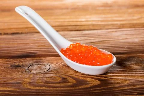 Red caviar in spoon Stock Photos