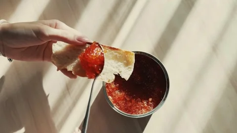 Red caviar spread on bread Stock Footage 254608739