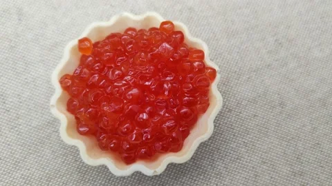 Red caviar in tartlets 스톡 동영상 167799422