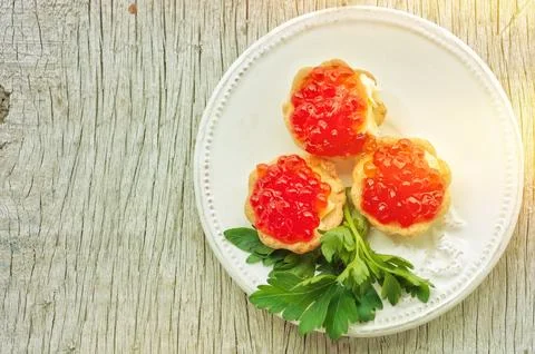 Red caviar in tartlets Stock Photos
