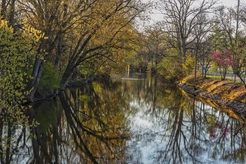 Red Cedar river winding through Michigan State University campus. Stock Photos