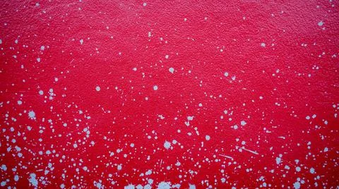 Red cement wall with splash marks, scattered mortar, used as a background or  Fotos de archivo