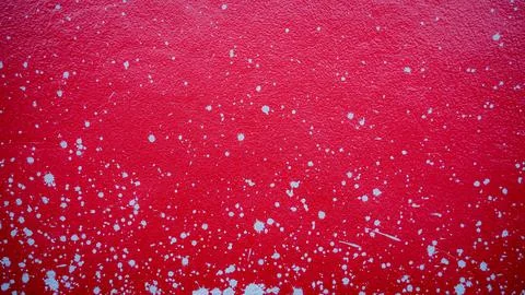 Red cement wall with splash marks, scattered mortar, used as a background o.. Stock Photos