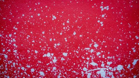 Red cement wall with splash marks, scattered mortar, used as a background o.. Stock Photos