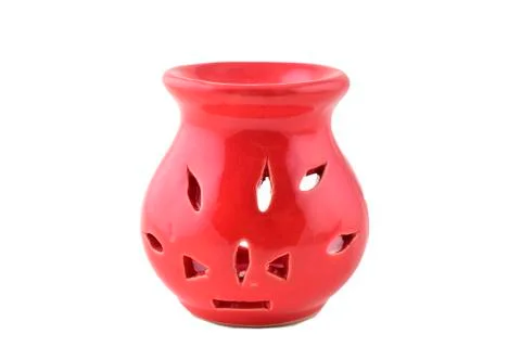 Red ceramic aroma oil diffuser isolated on white background Foto stock