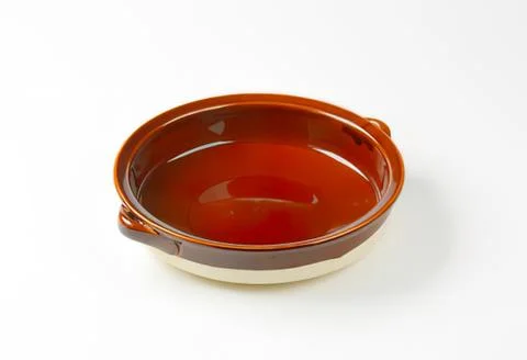 Red ceramic baking dish with two handles Stock Photos