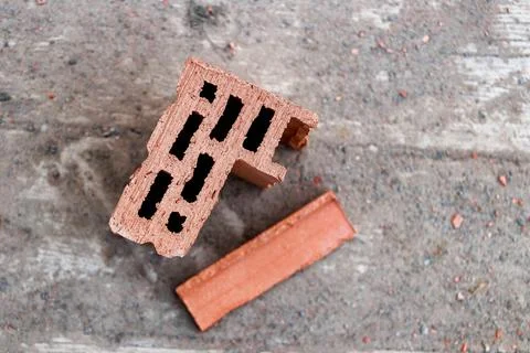 Red ceramic brick close up. Construction background. Construction of a brick  Stock Photos