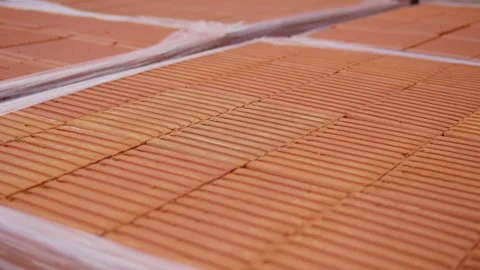 Red ceramic brick in factory packaging Video stock 165097057