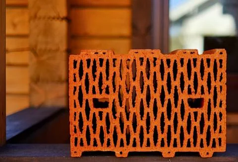 Red ceramic brick-made of special clay with roasting in the oven Stock Photos