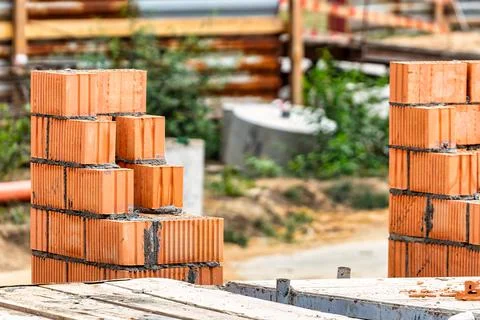 Red ceramic bricks at the construction site. Keramoblock. Hollow brick. Const 스톡 사진