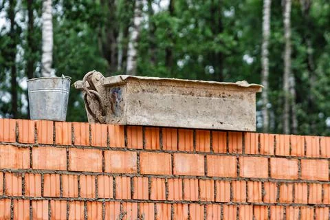 Red ceramic bricks at the construction site. Keramoblock. Hollow brick. Const 写真素材