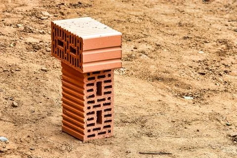 Red ceramic bricks at the construction site. Keramoblock. Hollow brick. Const 스톡 사진