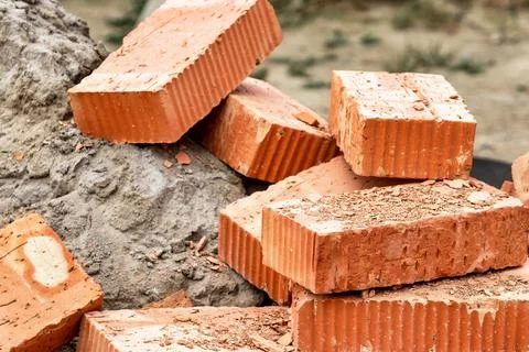 Red ceramic bricks at the construction site. Keramoblock. Hollow brick. Const Stock Photos
