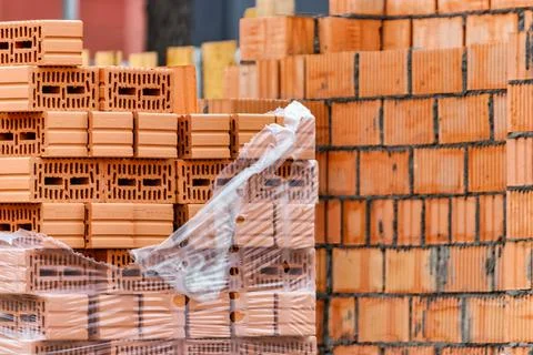 Red ceramic bricks at the construction site. Keramoblock. Hollow brick. Const 스톡 사진