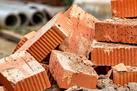 Red ceramic bricks at the construction site. Keramoblock. Hollow brick. Const Stock Photos