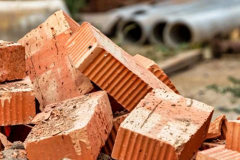 Red ceramic bricks at the construction site. Keramoblock. Hollow brick. Const Stock Photos