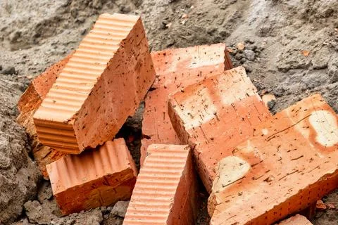 Red ceramic bricks at the construction site. Keramoblock. Hollow brick. Const 写真素材