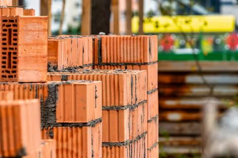 Red ceramic bricks at the construction site. Keramoblock. Hollow brick. Const Stock Photos