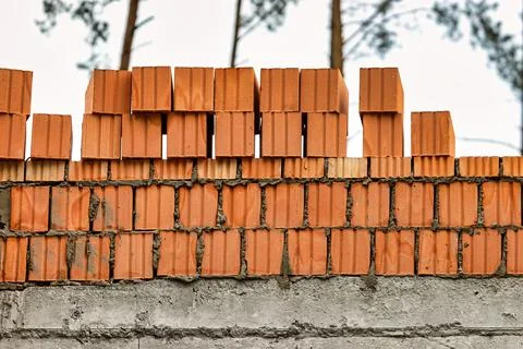 Red ceramic bricks at the construction site. Keramoblock. Hollow brick. Const Stock Photos