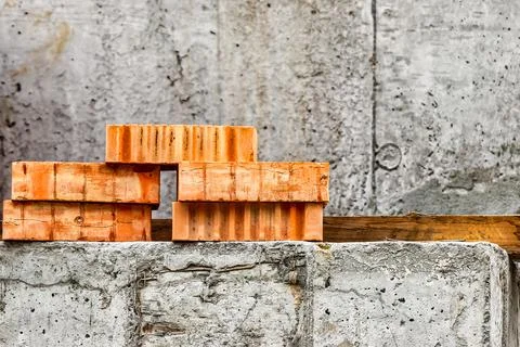 Red ceramic bricks at the construction site. Keramoblock. Hollow brick. Const Stock Photos