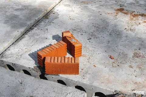 Red ceramic bricks at the construction site. Keramoblock. Hollow brick. Const Stock Photos