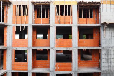 Red ceramic bricks at the construction site. Keramoblock. Hollow brick. Const Stock Photos