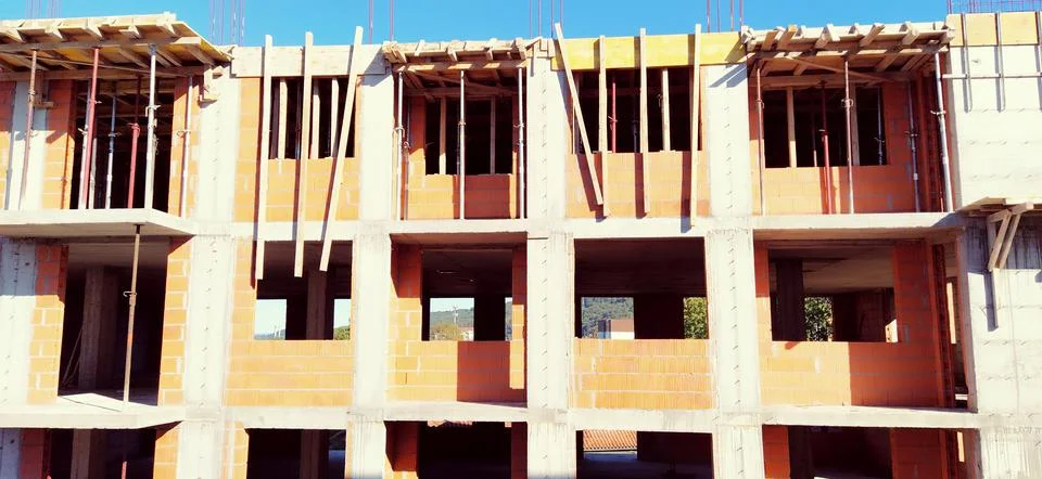 Red ceramic bricks at the construction site. Keramoblock. Hollow brick. Const Stock Photos