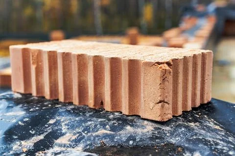 Red ceramic bricks at the construction site. Keramoblock. Hollow brick. Const Stock Photos