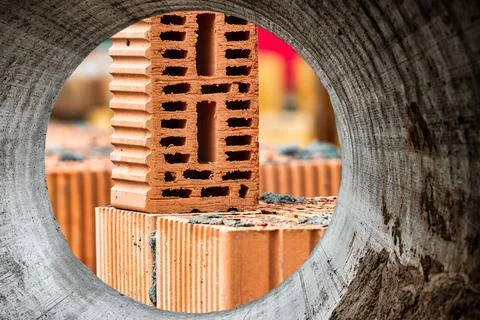 Red ceramic bricks at the construction site. Keramoblock. Hollow brick. Const 写真素材
