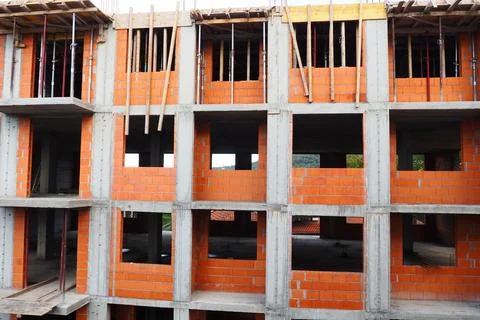 Red ceramic bricks at the construction site. Keramoblock. Hollow brick. Const Stock Photos