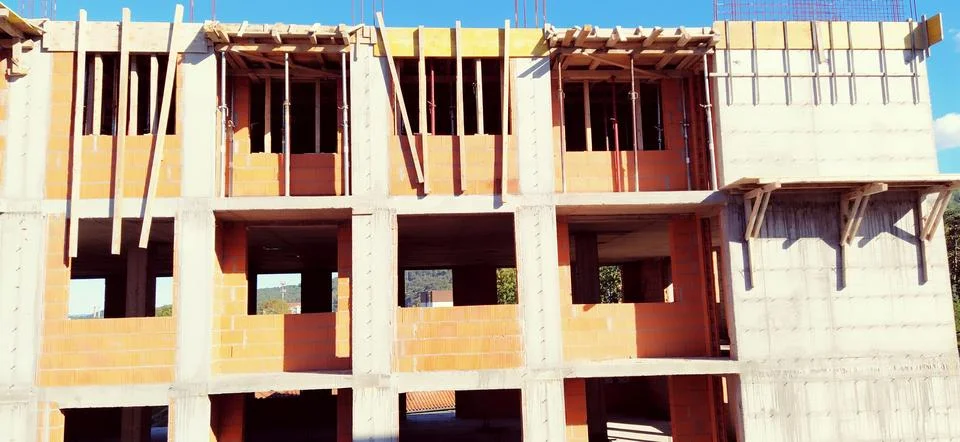 Red ceramic bricks at the construction site. Keramoblock. Hollow brick. Const Stock Photos