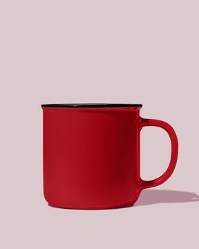 Red ceramic mug on pink background. Mockup. Stock Photos