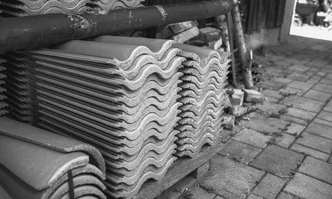 Red ceramic roof tiles stack in backyard.High quality photo Stock Photos