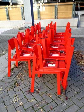 Red Chair Stack Outside Stock Photos