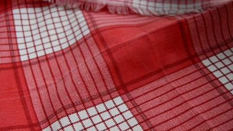 Red checkered fabric background, close-up, selective focus Stock Photos