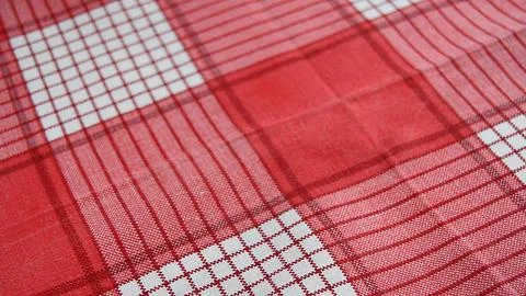 Red checkered fabric background, close-up, selective focus Stock Photos