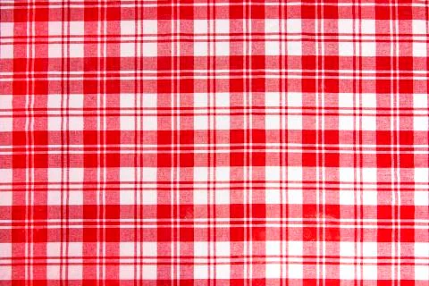 Red checkered tablecloth fabric background texture, close-up. Stock Photos