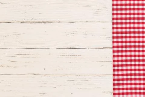 Red checkered tablecloth on rustic white wooden table background Stock Photos