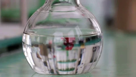 Red chemical reagent in a flask Video stock 75913433