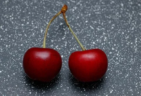 Red cherries on an abstract background are small, juicy fruits of a bright .. Stock Photos