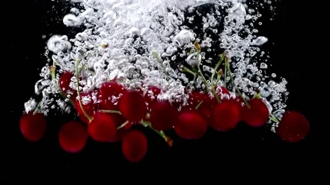 Red Cherries Falling Into Water Video stock 132334651