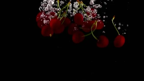 Red Cherries Falling Into Water Video stock 132335031