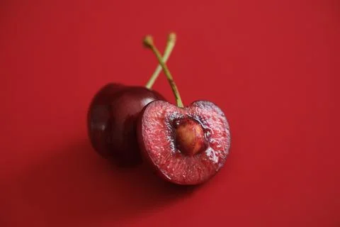 Red cherries on red background Stock Photos