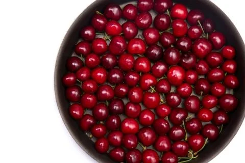 Red cherries in round baking tin Foto stock