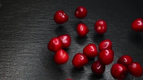 Red cherries in slow motion on a dark background Stock Footage 132604634