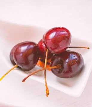 Red cherries with spoon. Stock Photos