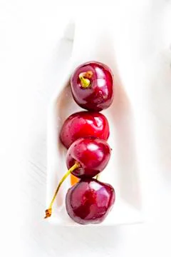 Red cherries with spoon. Stock Photos