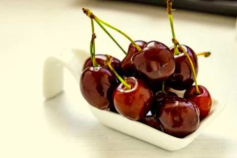 Red cherries with spoon. Stock Photos
