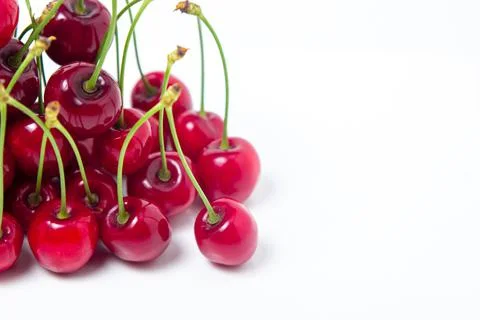 Red cherries on a white background. Sweet cherry with tails. Stock Photos