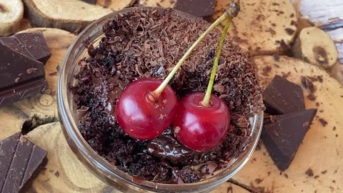 Red cherry in chocolate chips and dark chocolate pieces. dessert Video stock 200919350